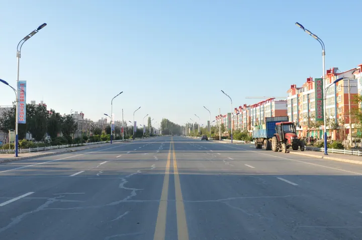 Road with apartment blocks in Manas County