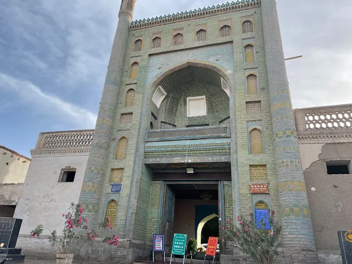 Ornate tiled gateway and minaret of the Jiaman Mosque in Yarkant, Xinjiang