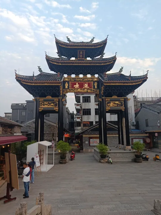 Ornate multi-tiered memorial archway in a Cantonese water village