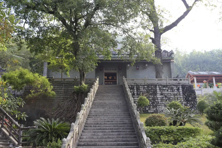 Long stone staircase ascending through trees to the Han Wen Gong temple hall