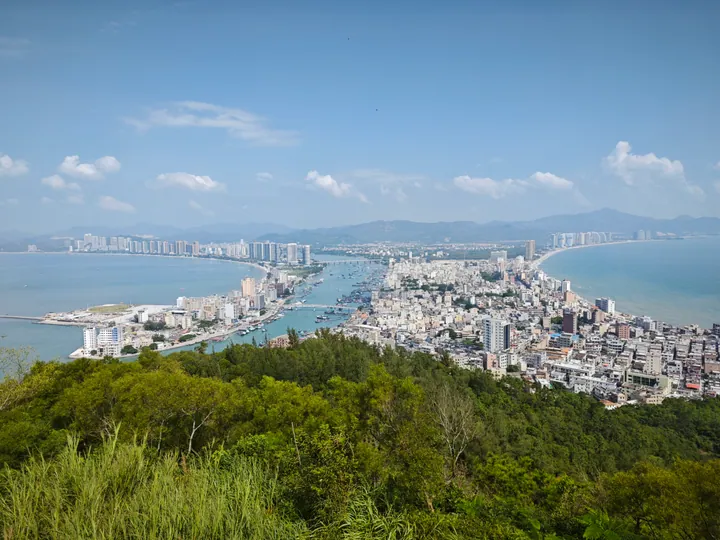 Elevated view of the twin bays and coastal town of Shuangyue Bay