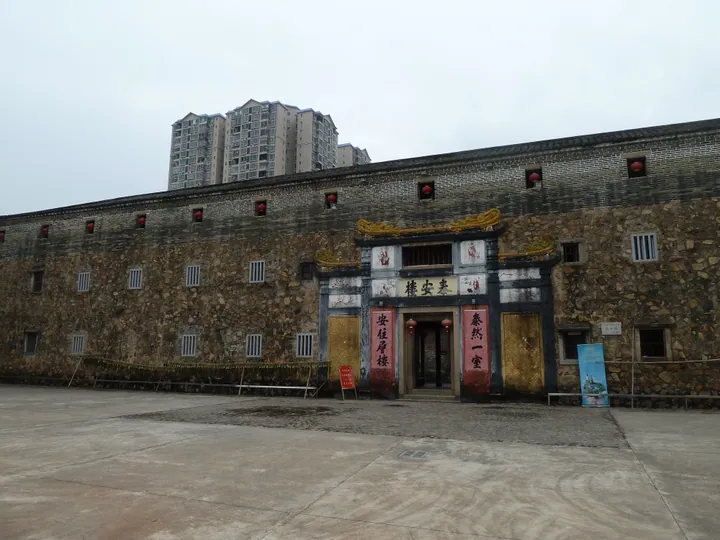 Front facade and gated entrance of the walled Tai'an Building