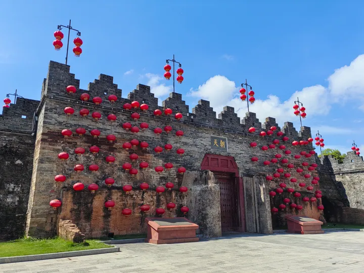 Stone city wall gate tower decorated with red lanterns