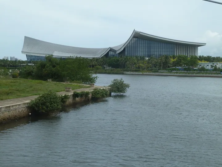 Wave-roofed museum building seen across the water