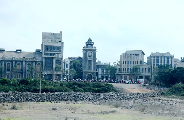 Recreated old-style street with a central clock tower at Feng Xiaogang's Movie Town