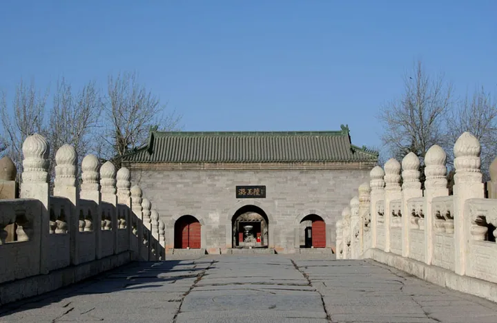 Stone bridge and carved balustrade leading to the red-doored gate hall of Mausoleum of Prince Lu, inscribed with its name