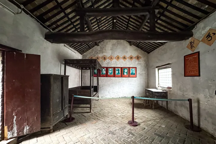 Preserved historical room with old furniture and portraits on the wall at the memorial hall