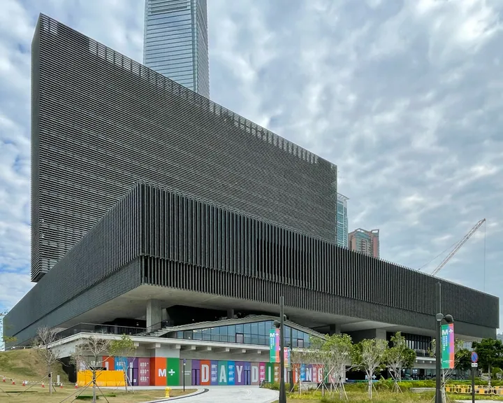 Exterior of the M+ museum building with its distinctive louvred facade