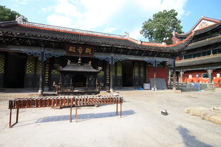 Temple courtyard with the Guanyin Hall and incense rack at Puguang Chan Temple