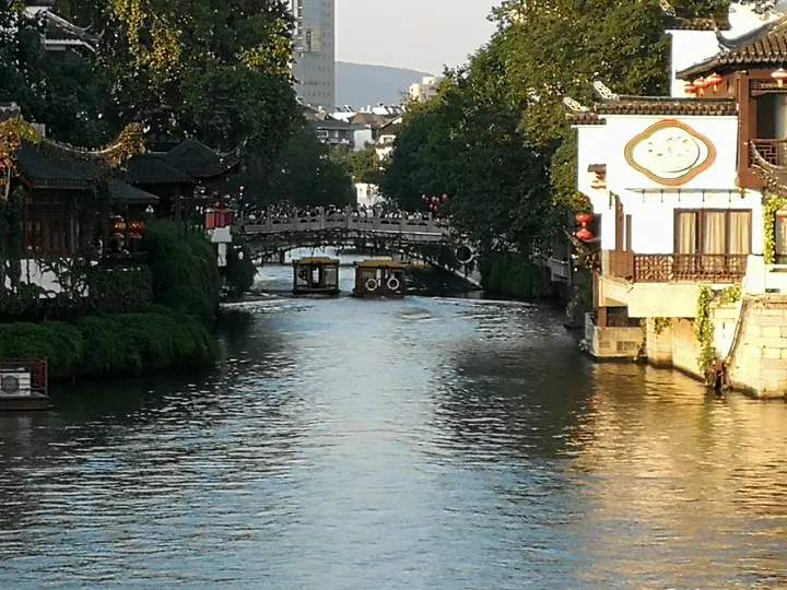Qinhuai River canal with an arched bridge and riverside buildings near the Confucius Temple, Nanjing