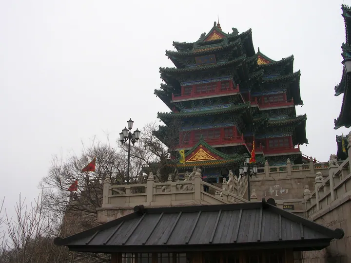 Tall red and green multi-storey pagoda-style tower