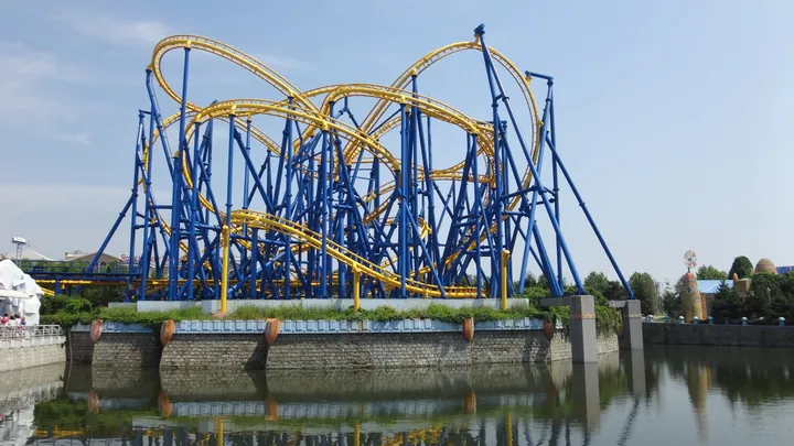 Roller coaster track over water at Discovery Kingdom amusement park in Dalian