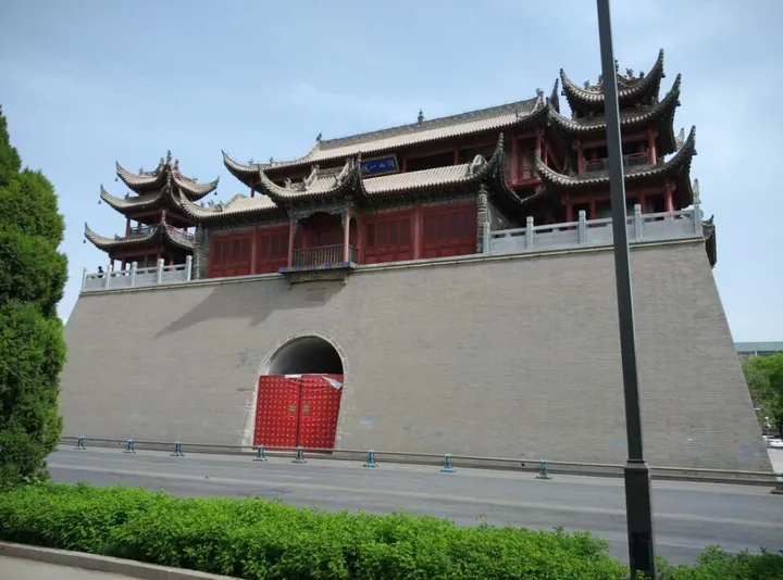 Multi-tiered red and grey pavilion atop a brick platform in Yinchuan