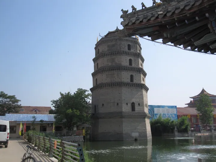 Multi-story brick pagoda beside a pond in Juye County, Shandong