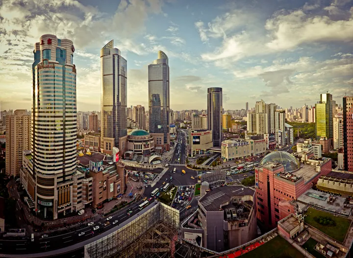 Cluster of modern skyscrapers above a busy intersection in Xujiahui, Shanghai