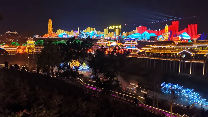 Colorful illuminated lantern sculptures and pavilions lit up at night