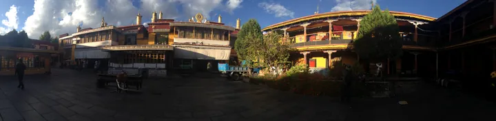 Wide view of the golden-roofed temple buildings and courtyard at Zaki Temple, Lhasa