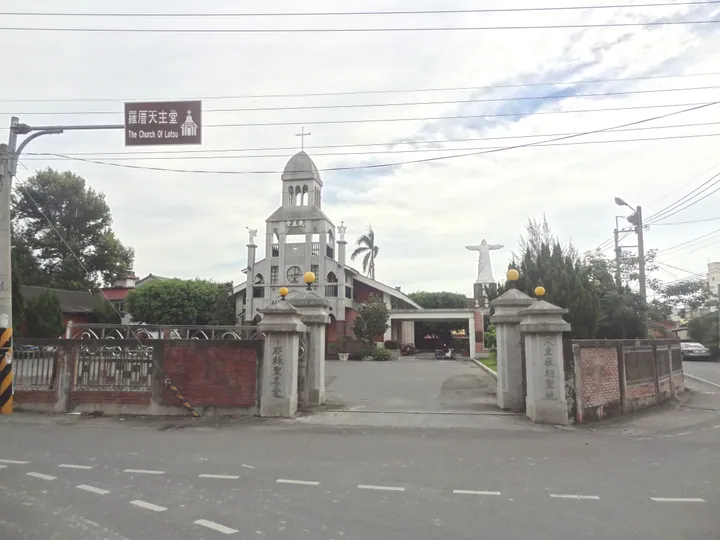 A church with a bell tower and gate in Puxin Township