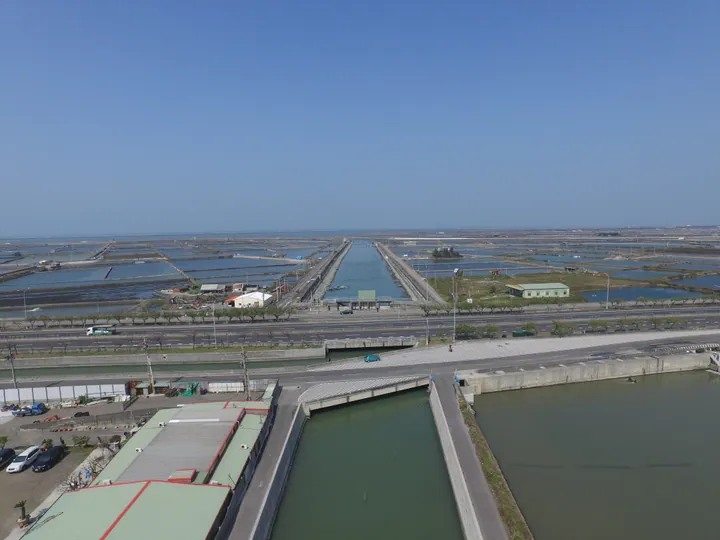 Aerial photo of fish ponds and a canal bridge in Kouhu Township