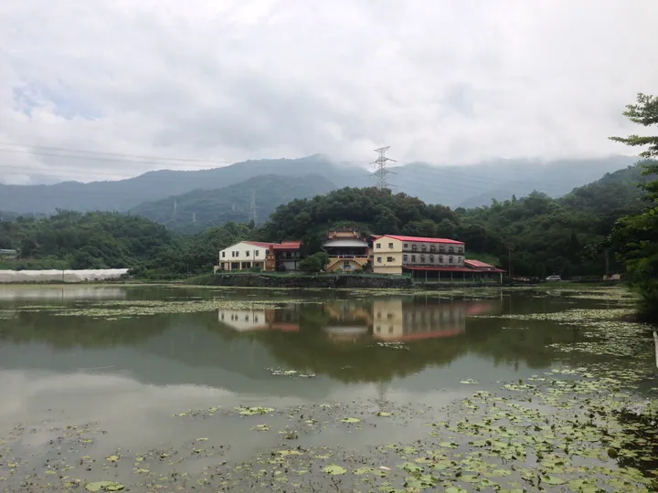 Temple buildings reflected in Xiangtan pond, Xinpi Township