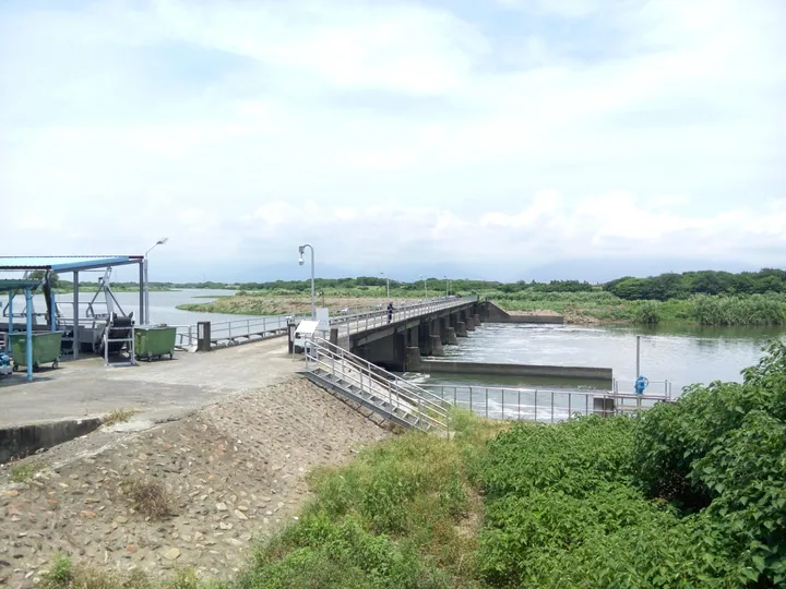 A river weir and pedestrian walkway over the Donggang River in Pingtung, Taiwan
