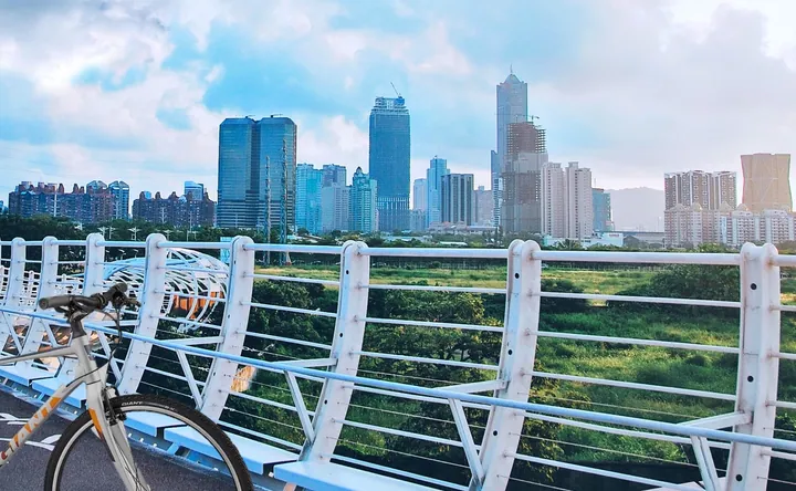 City skyline of Cianjhen District, Kaohsiung with a bicycle in the foreground