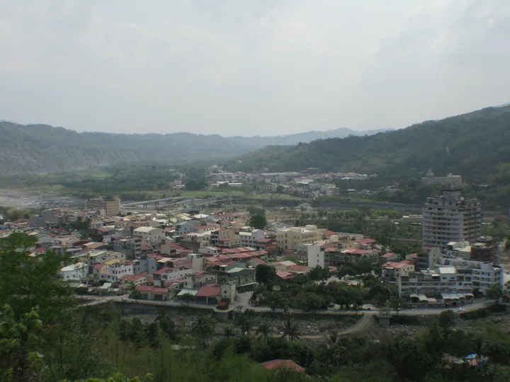 Overview of Jiasian District town and riverbed surrounded by mountains