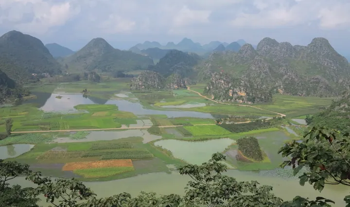 Wide view of Puzhehei's karst hills, lakes and farmland
