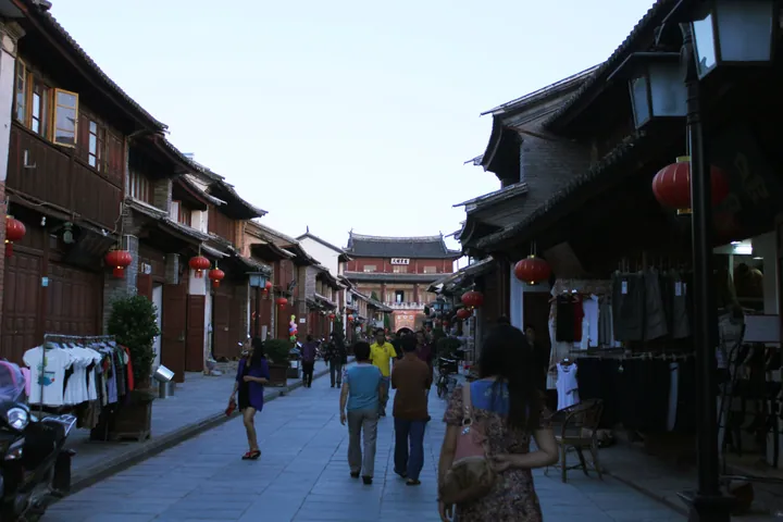 A lantern-lined street in Weishan Old Town leading toward Gongchen Gate