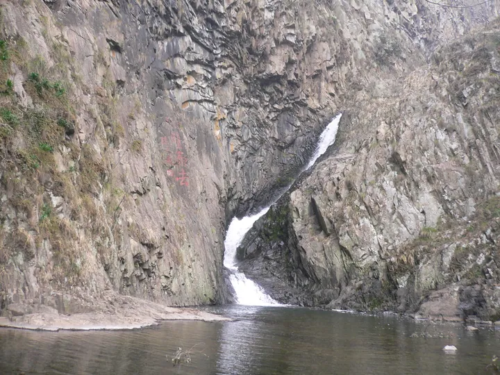 Waterfall cascading through a rock gorge at Wuxie, Zhuji
