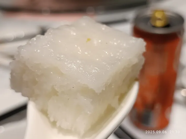 Close-up of a square of Cantonese lun jiao gao white sugar sponge cake