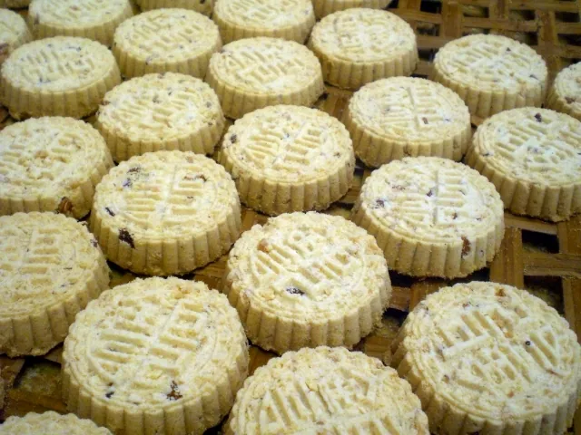 Tray of round stamped almond biscuits