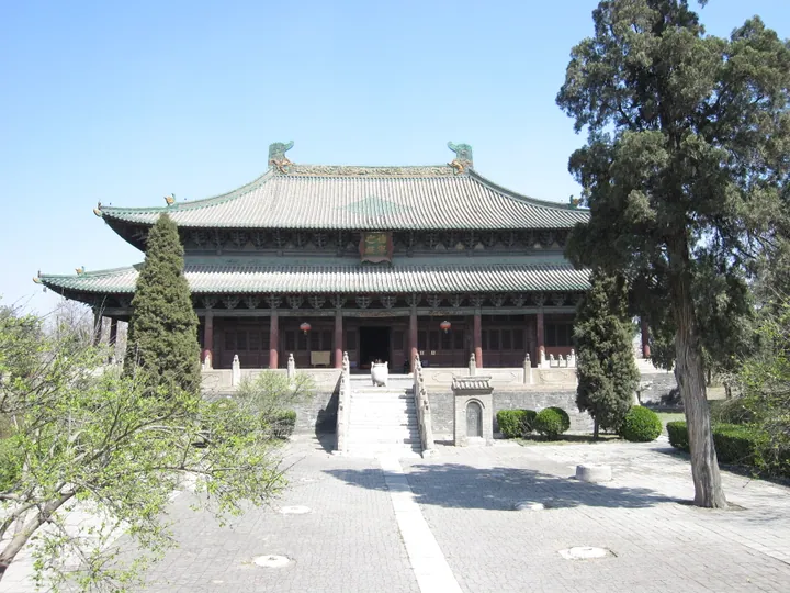 Large traditional Chinese temple hall with a green tiled roof at Beiyue Temple, Quyang