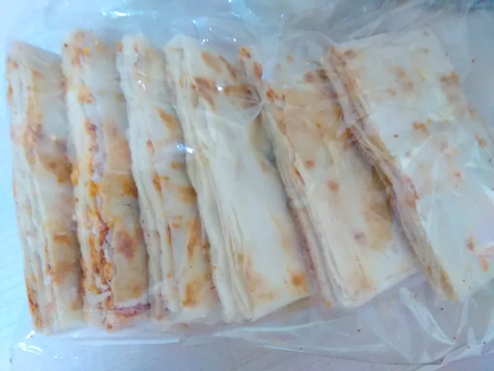 Stack of thin crispy Qufu pancakes in a bag
