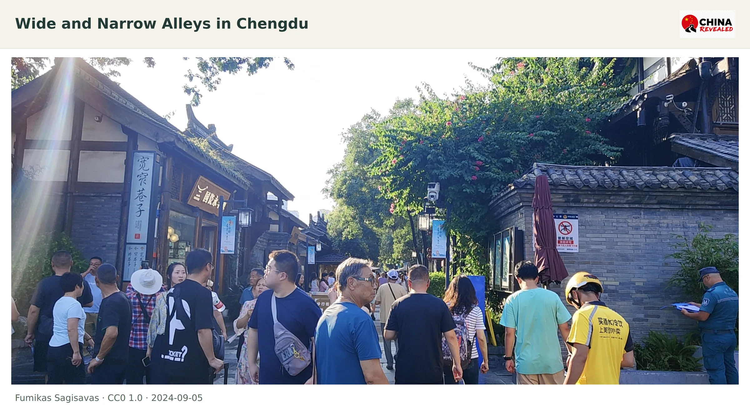Visitors walking through the historic Wide and Narrow Alleys in Chengdu among tiled roofs and small shops