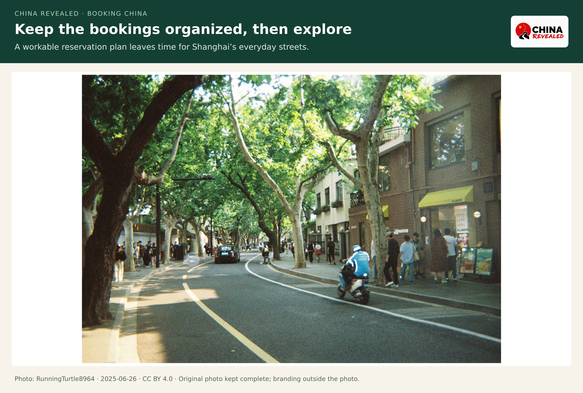 Plane-tree-lined Wukang Road in Shanghai with scooters and low-rise shops, photographed in June 2025.